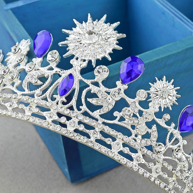 Royal Crown Headwear and Accessories featuring intricate silver-tone design with crystal rhinestones and purple accents.