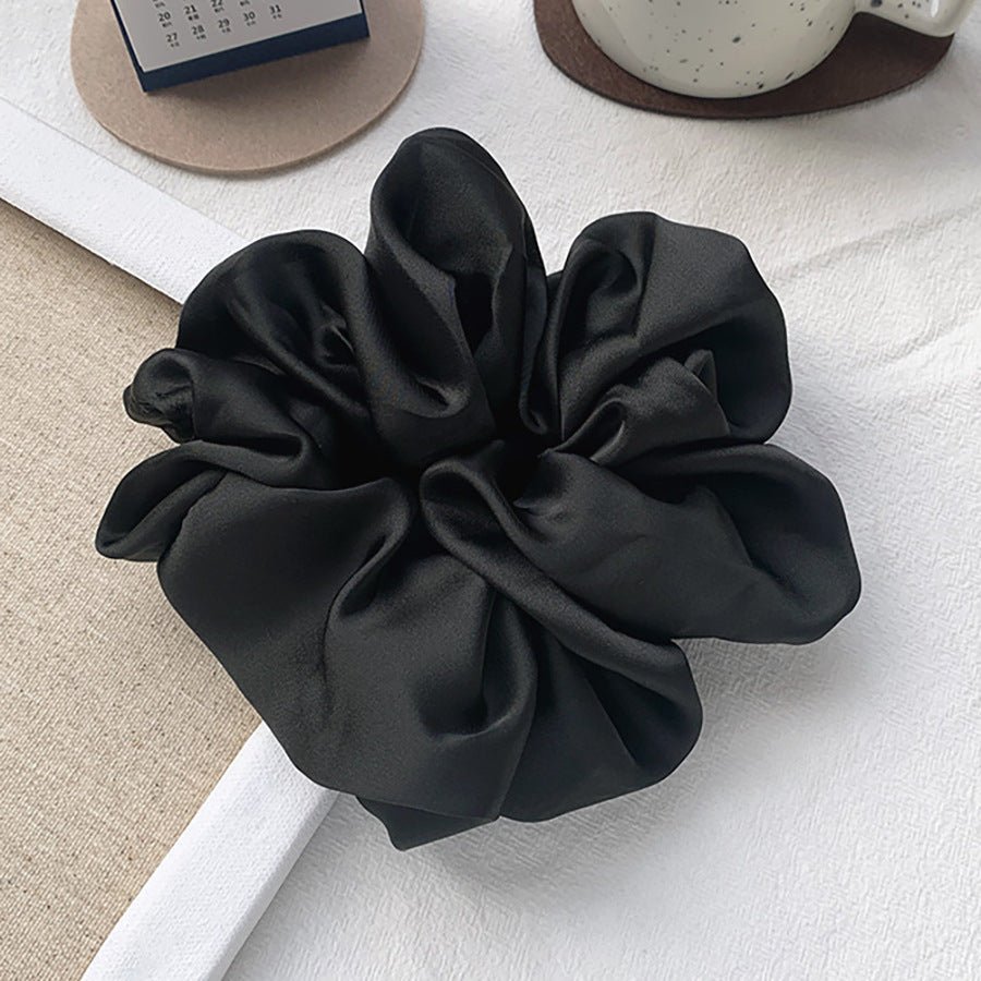 French Hair Clips and Barrettes in luxurious satin black, perfect for adding elegance to hairstyles.